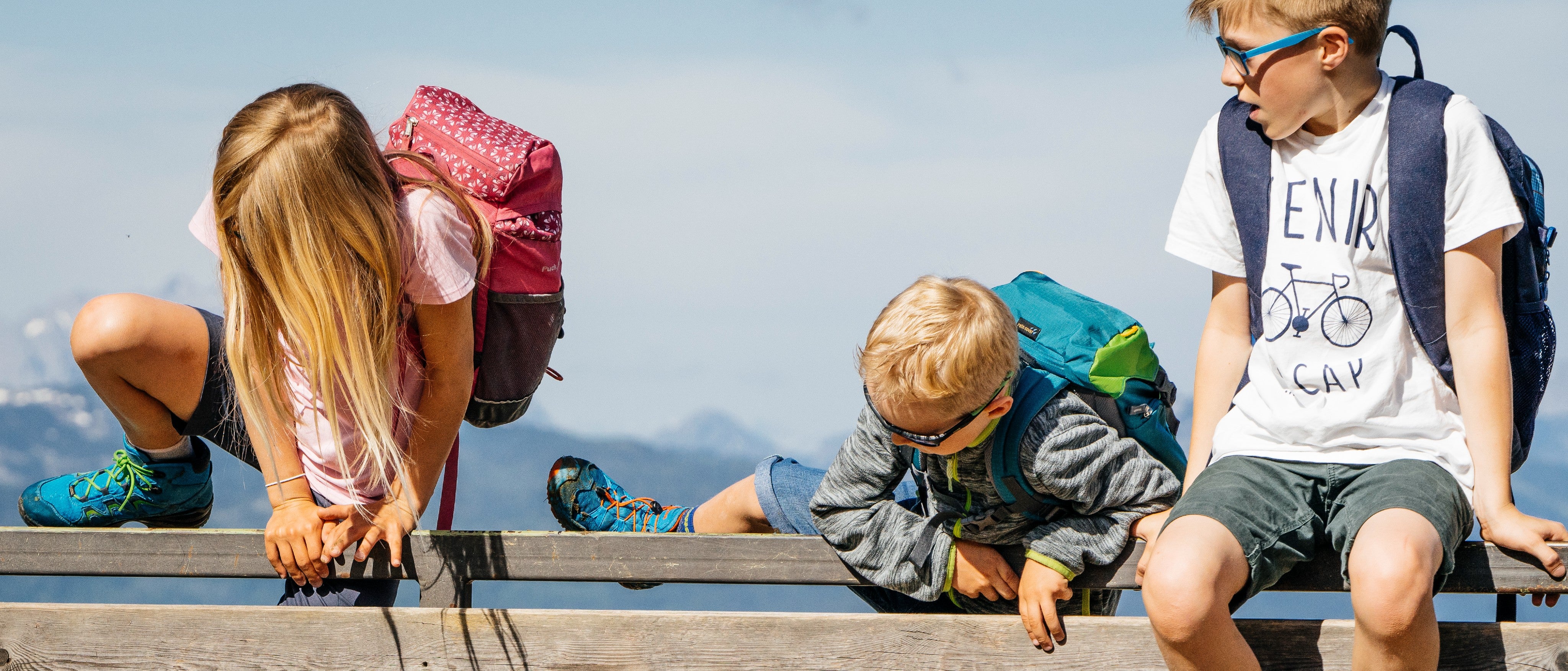 Kids climbing on fence