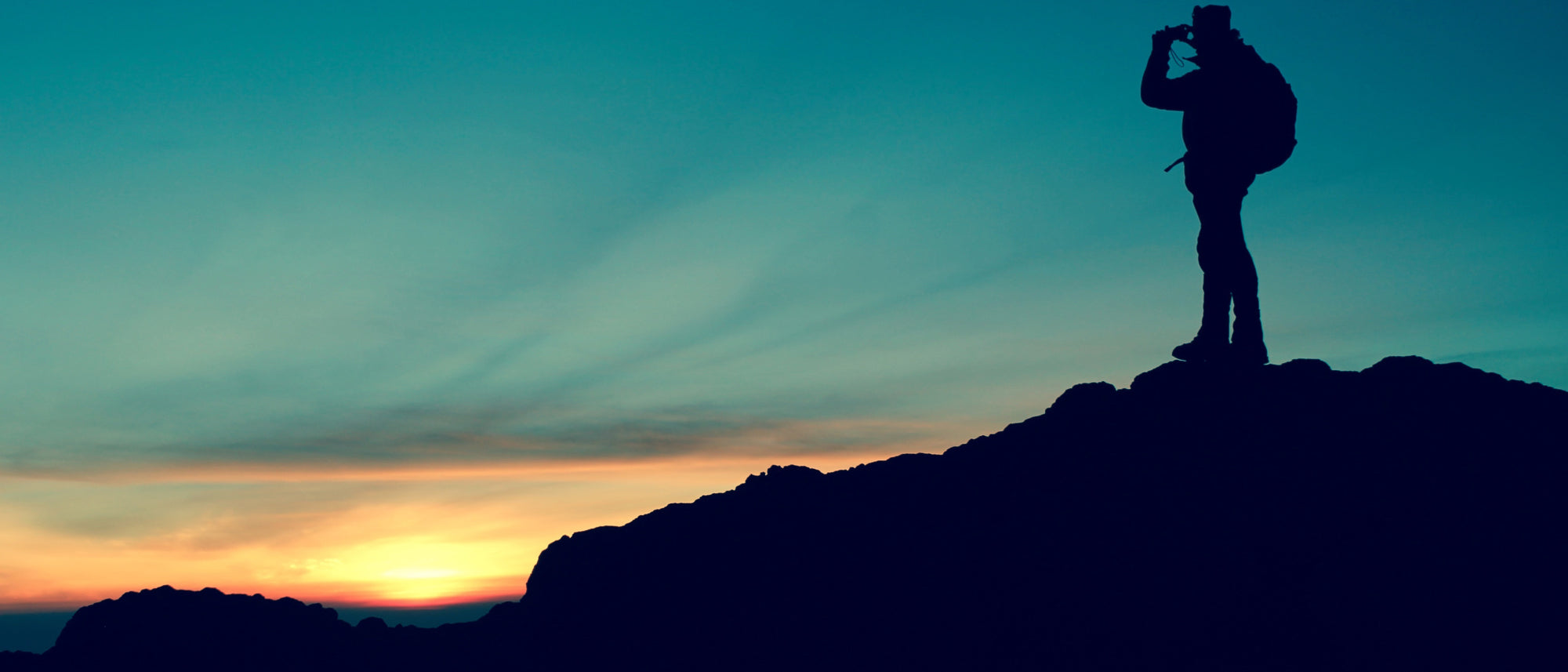 Silhouetted Hikers at Sunrise