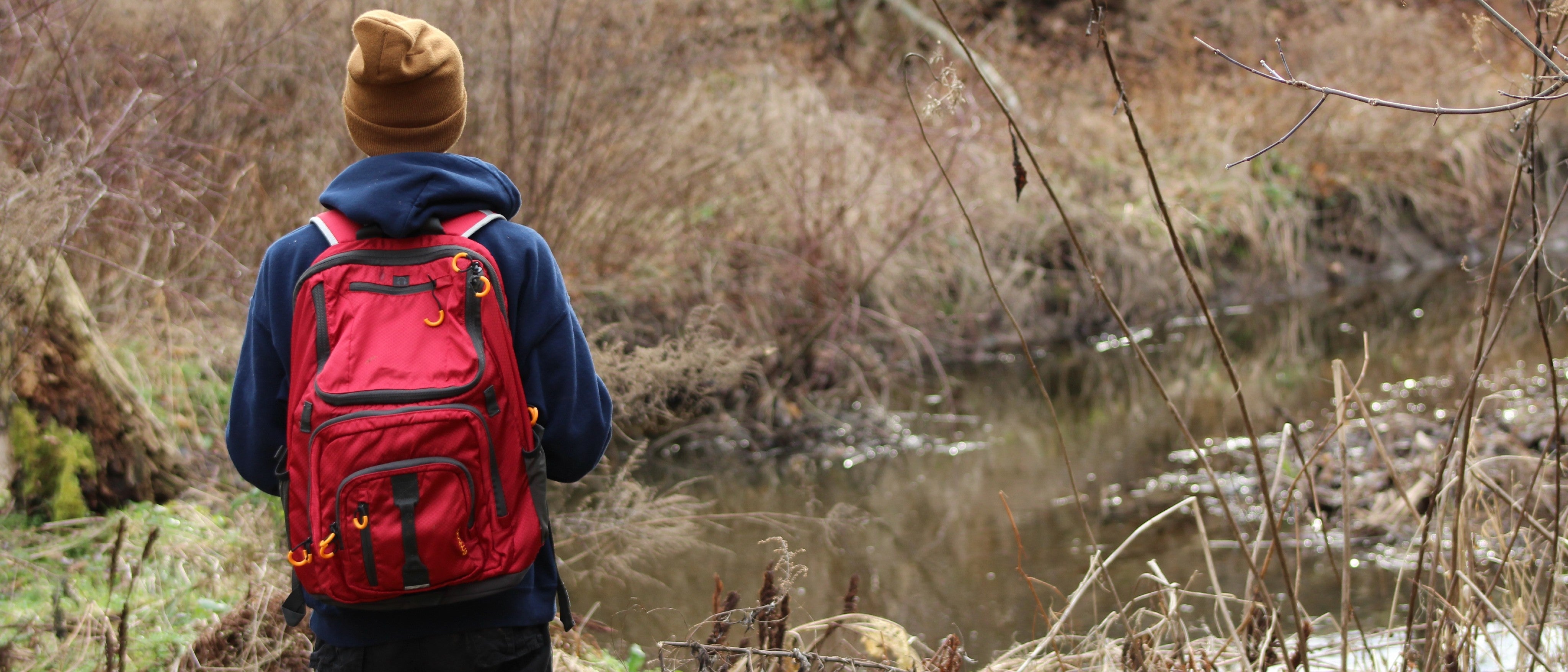 Man stood looking at water